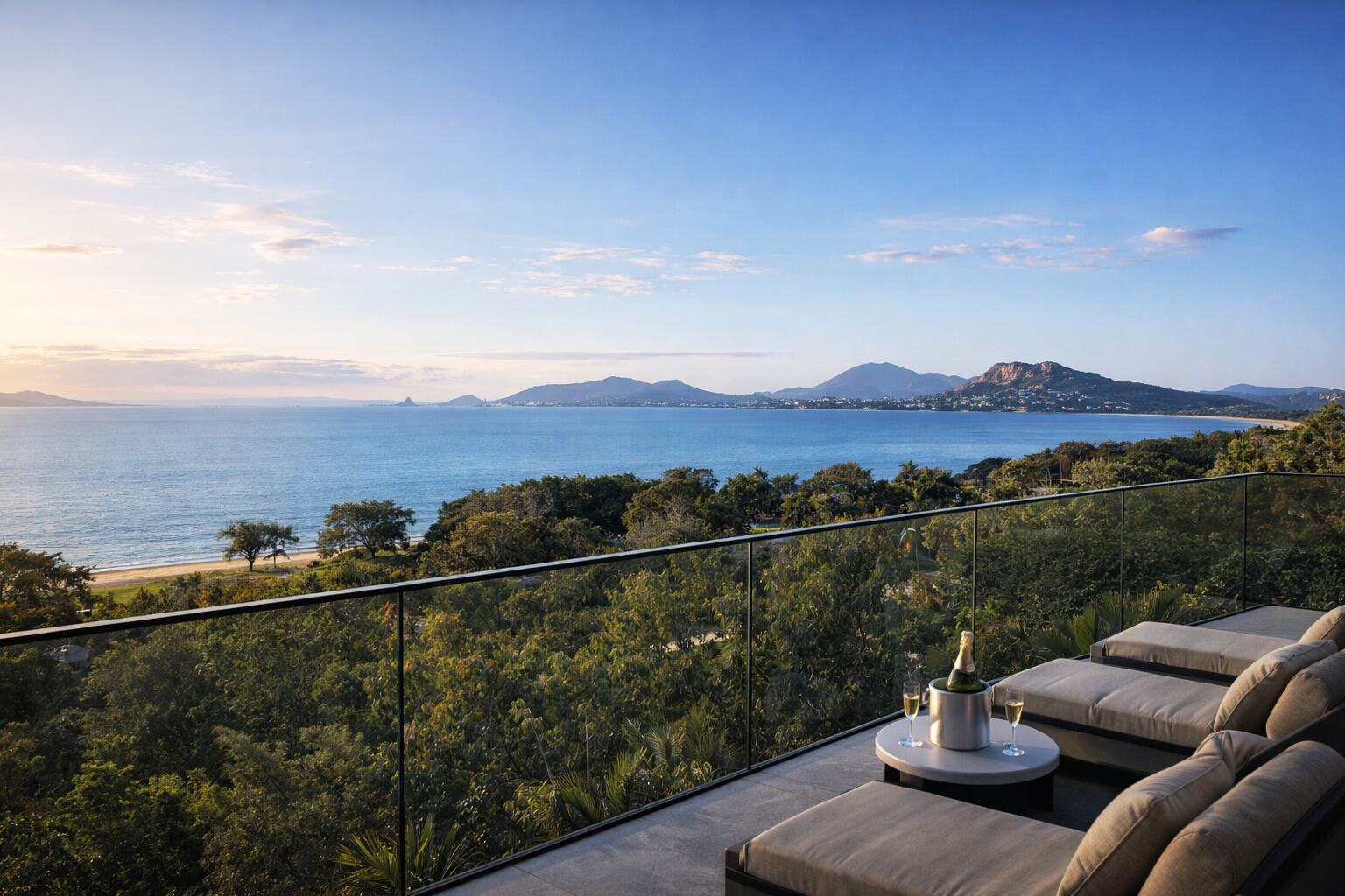Terrace with loungers looking across the bay to the city and Castle Hill